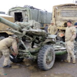 In the gun park getting a familiarisation of L119 from gun crew